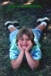 Rae lies on the grass